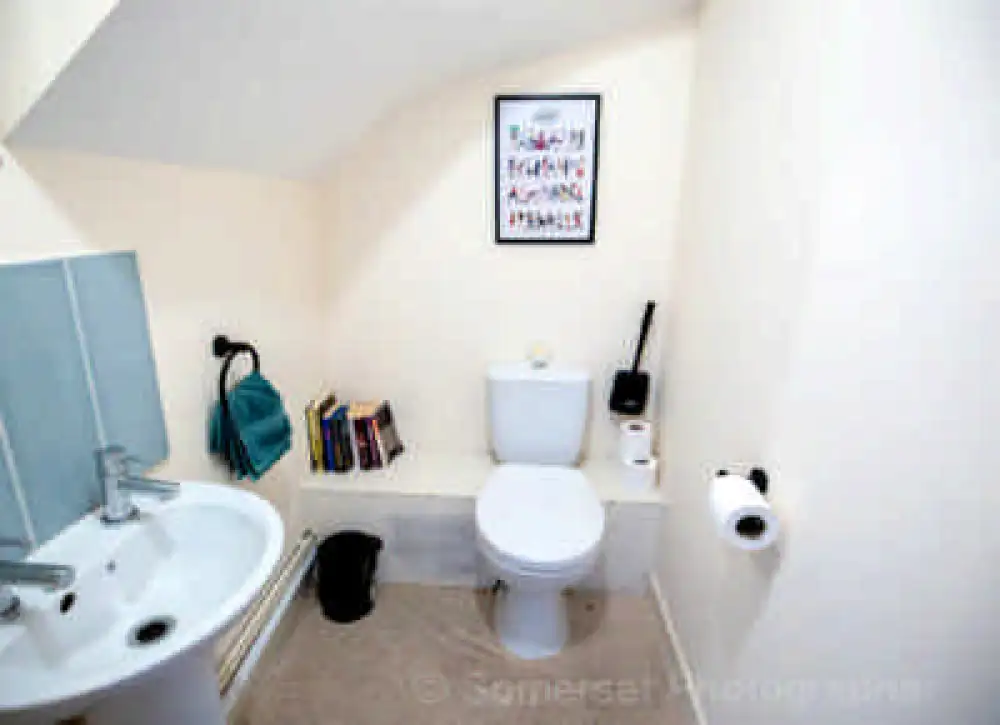 Downstairs WC featuring a toilet and hand basin