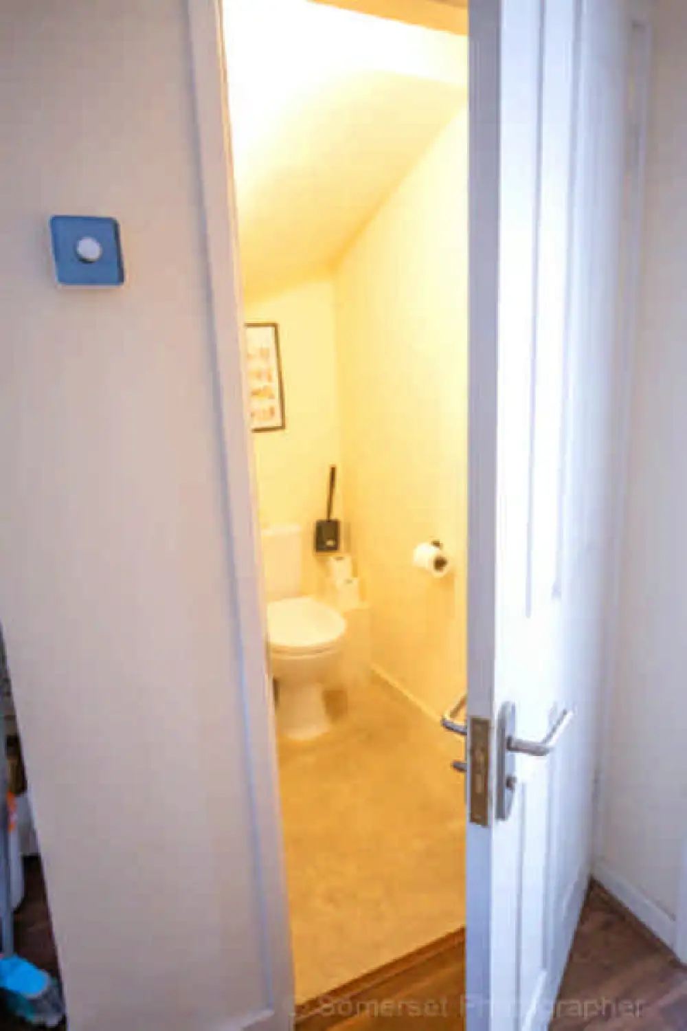 Downstairs WC featuring a toilet and hand basin